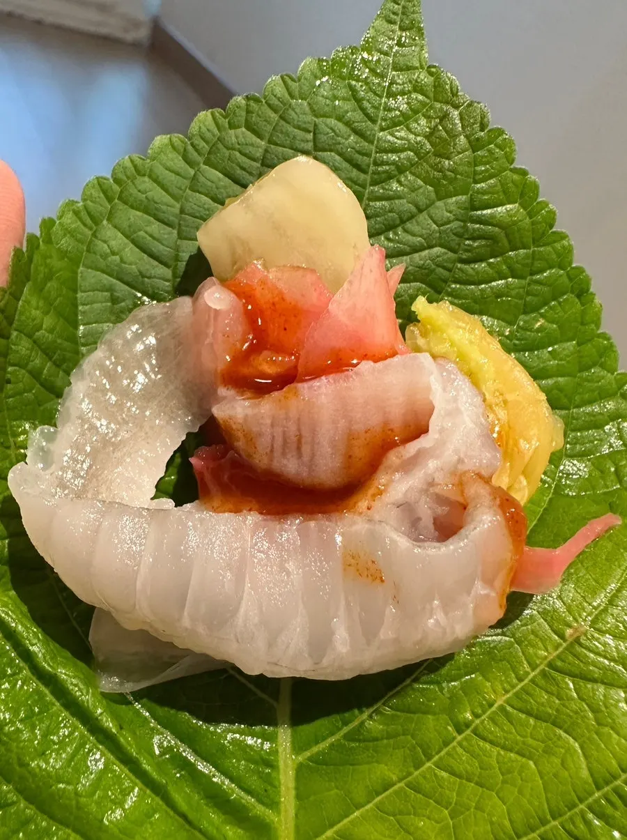 Takeout assorted sashimi with accompanying vegetables