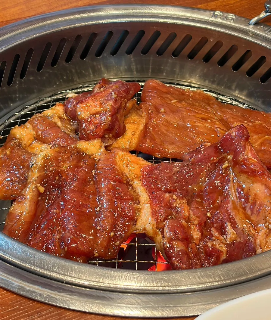 Two servings of hand-trimmed pork galbi on the table