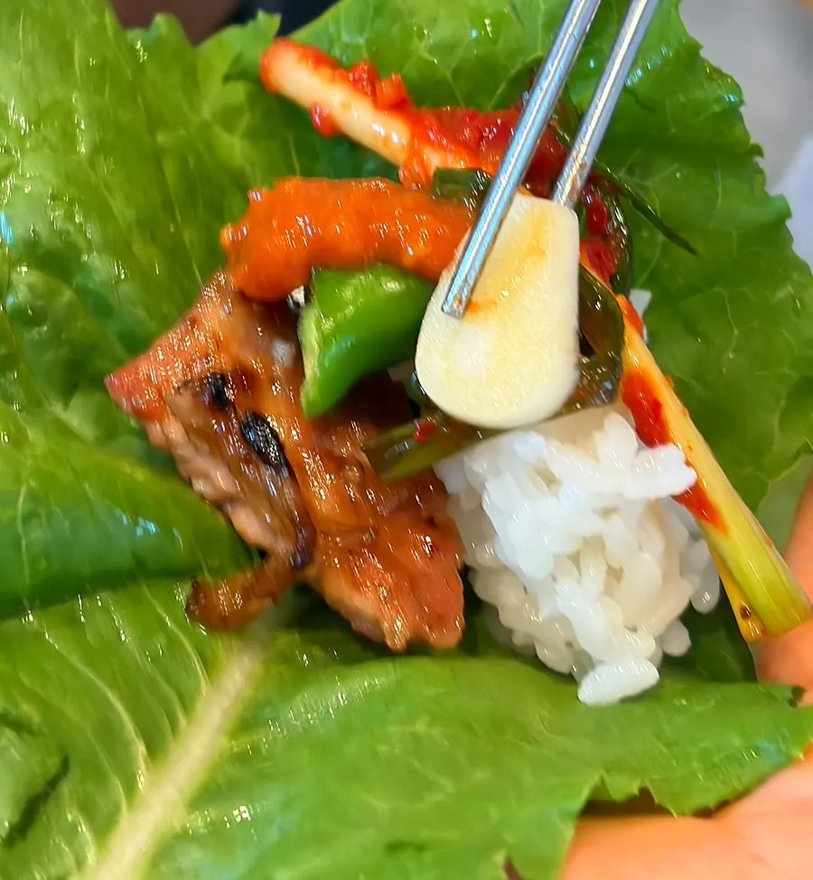Close-up of pork galbi cooking to perfection
