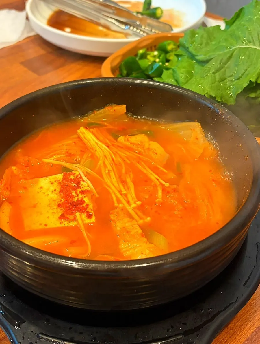 Grilled pork galbi served with chive kimchi