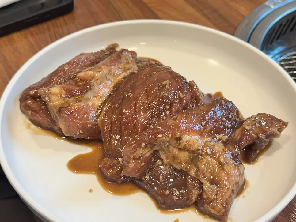 Pork galbi grilling over charcoal
