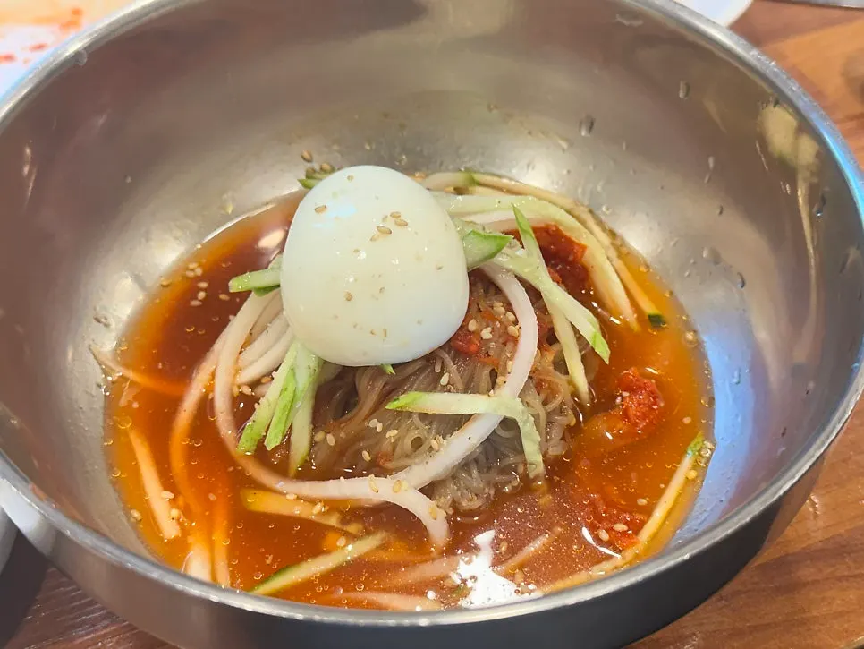 A bowl of marinated pollock naengmyeon