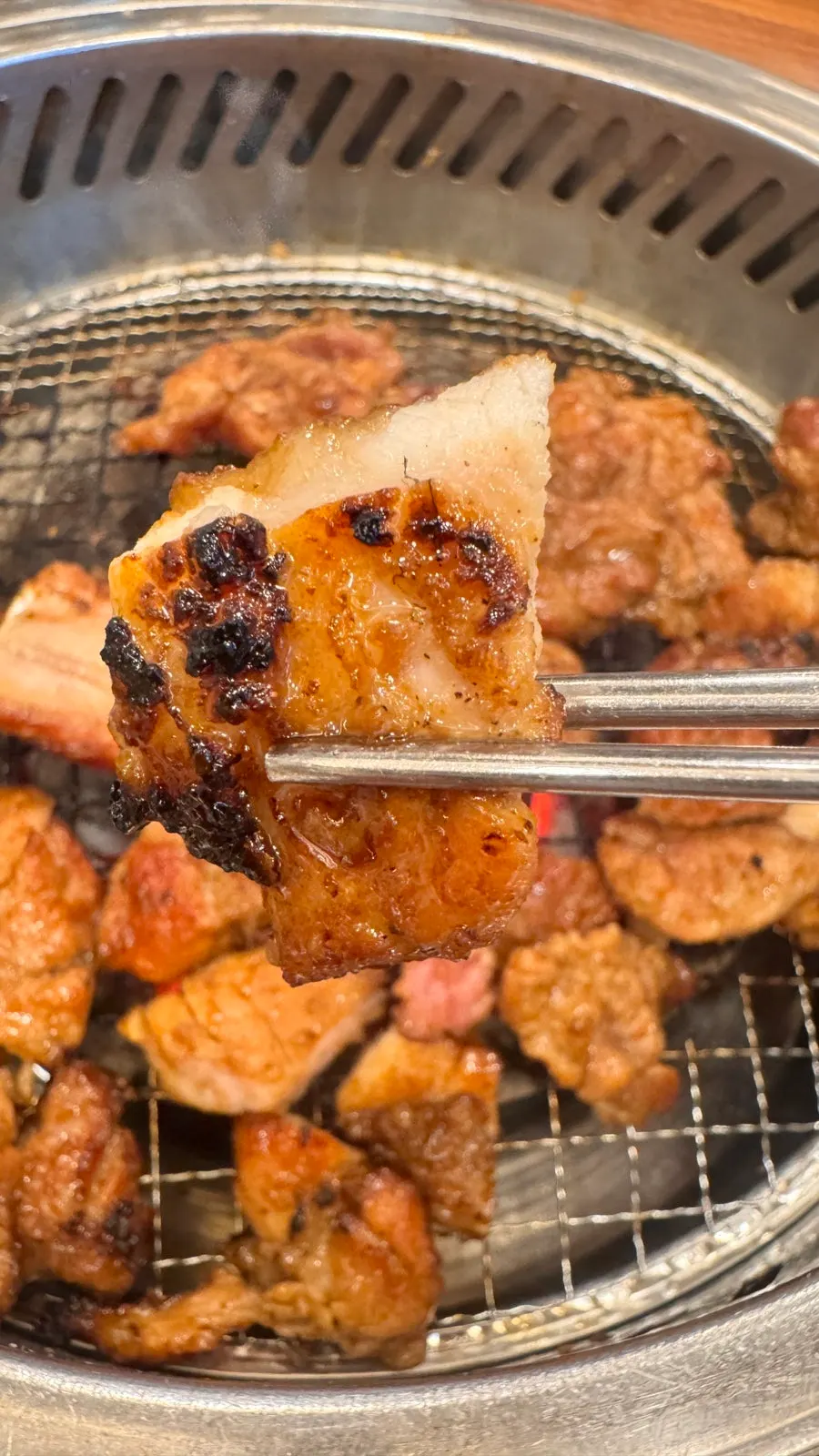 Marinated pork galbi grilling over charcoal