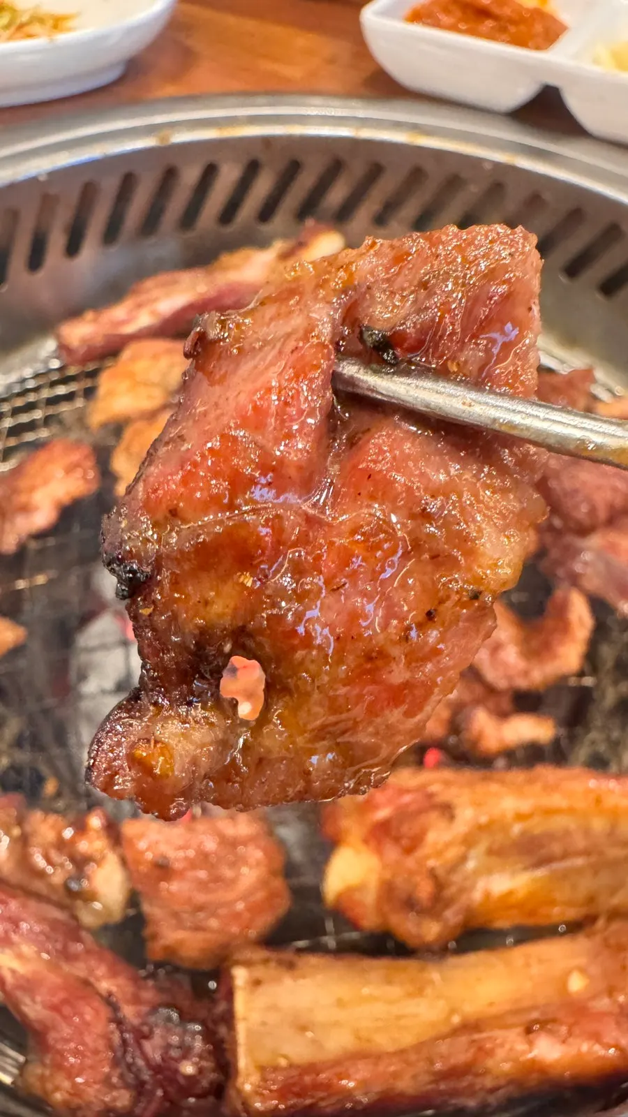 A fully grilled piece of marinated galbi