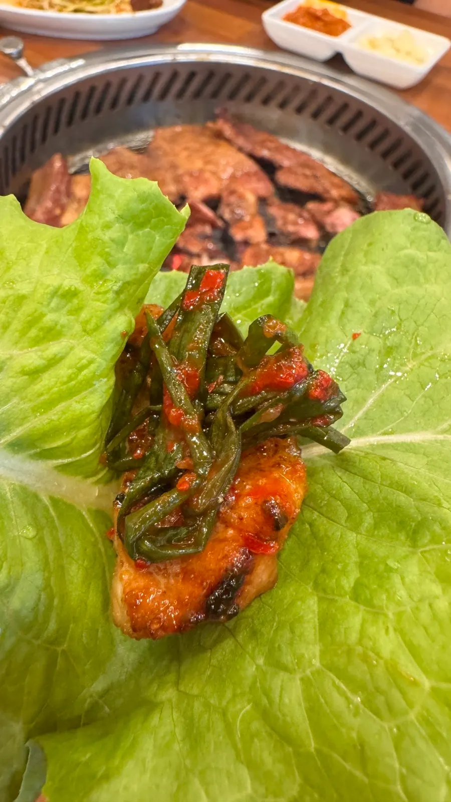 Marinated galbi topped with green onion kimchi