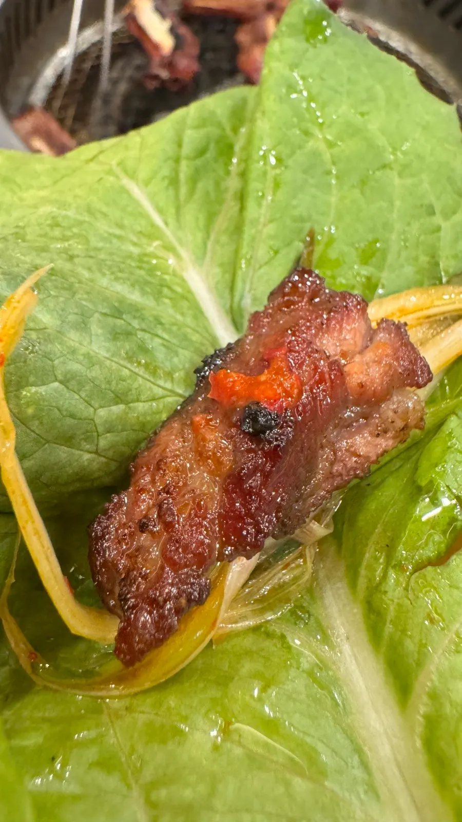 Pork galbi eaten with seasoned green onions