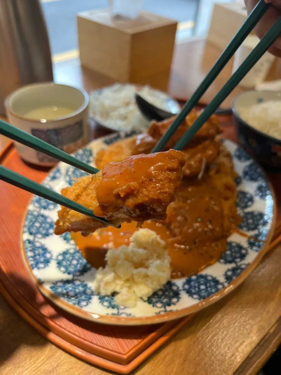 Cross-section showing the crispy-outside, juicy-inside tonkatsu