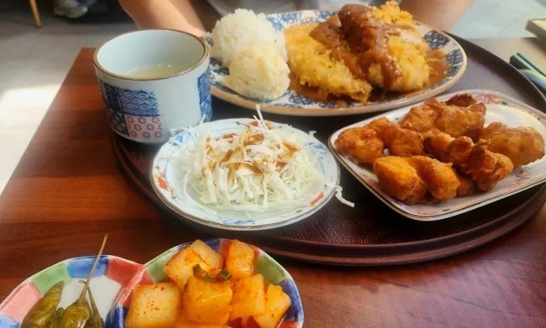 Plate of toowoomba demi-glace tonkatsu topped with sauce
