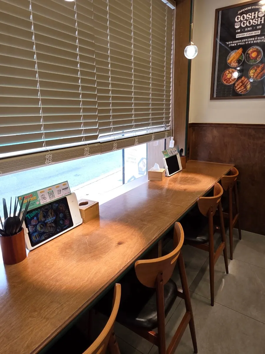 Interior view showing the semi-open kitchen at Goshi Goshi