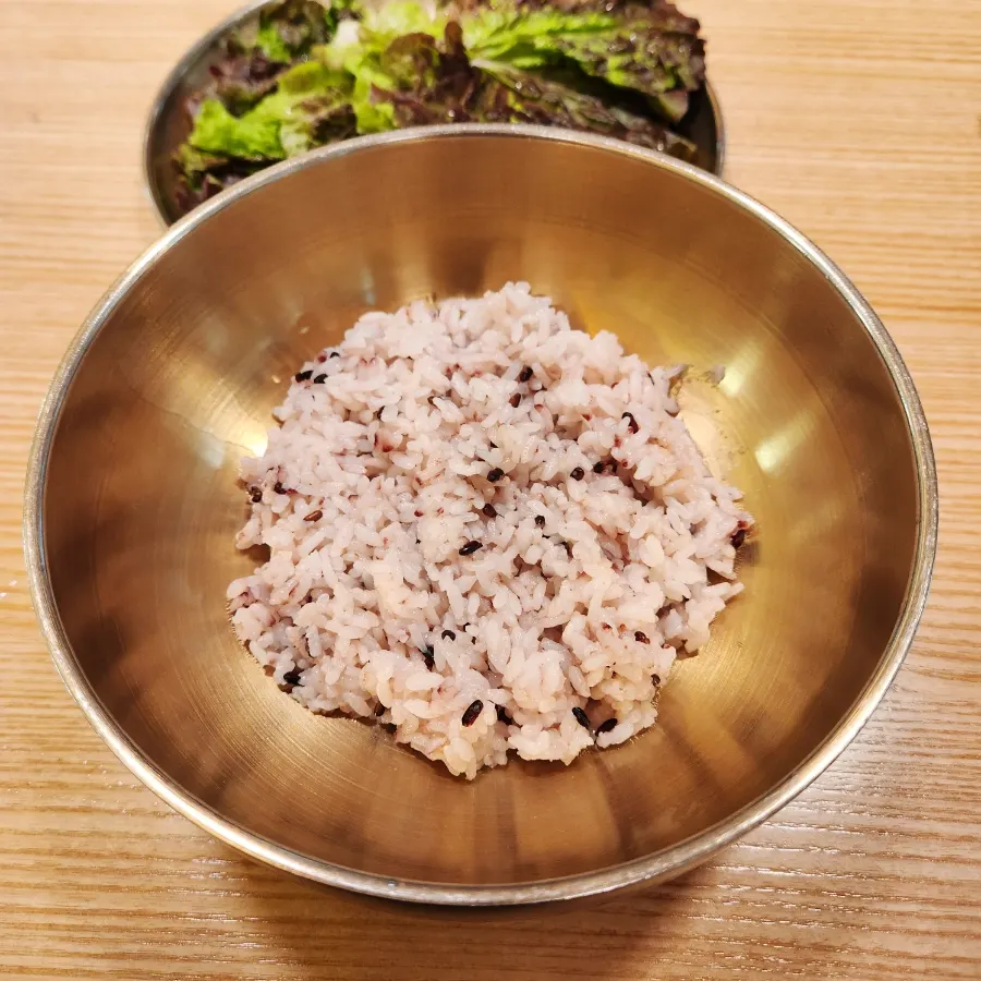 Table set with lettuce wraps and side dishes at Bapjangin