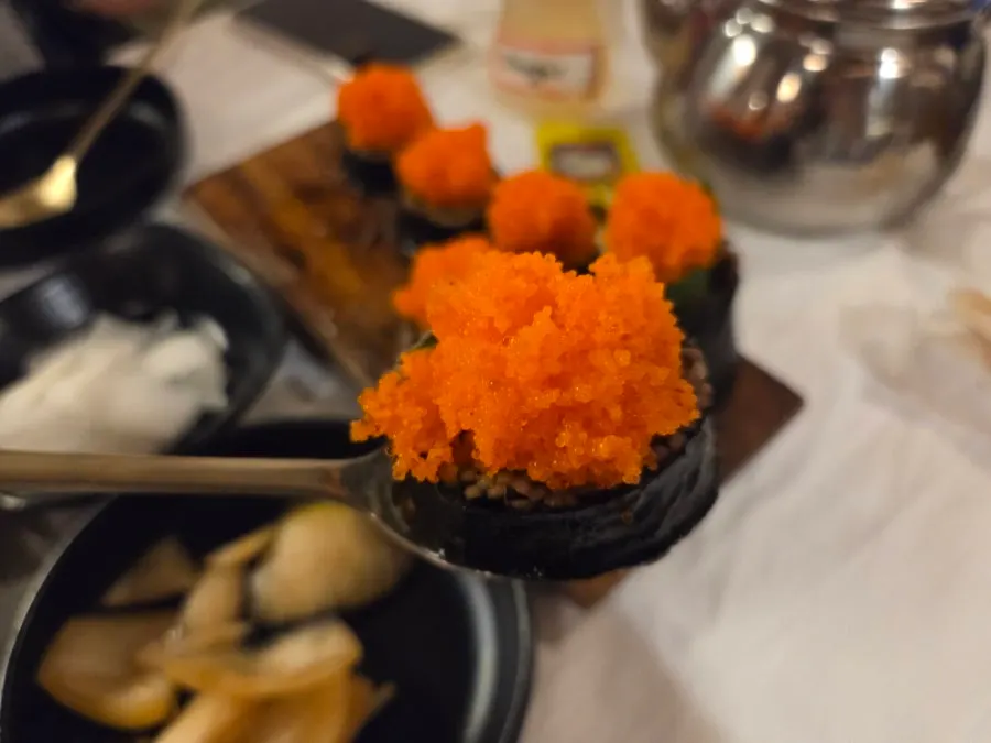 Flying fish roe buckwheat gimbap piled high with roe