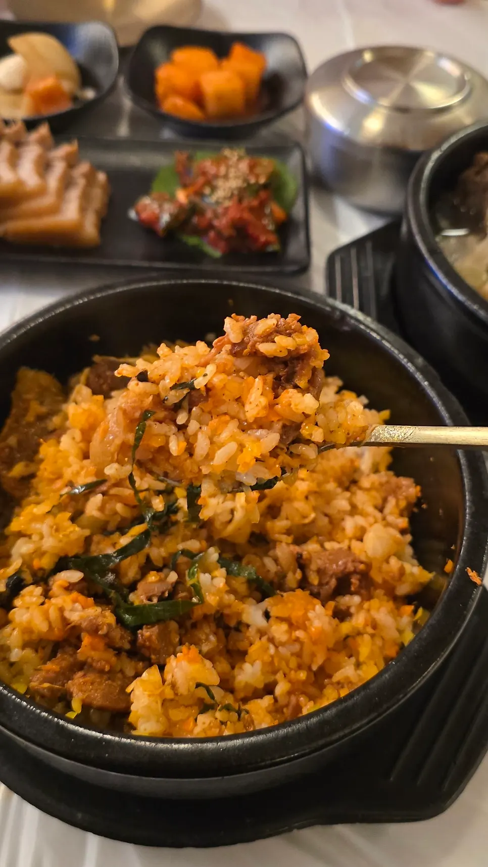 Close-up of stone pot bibimbap before mixing