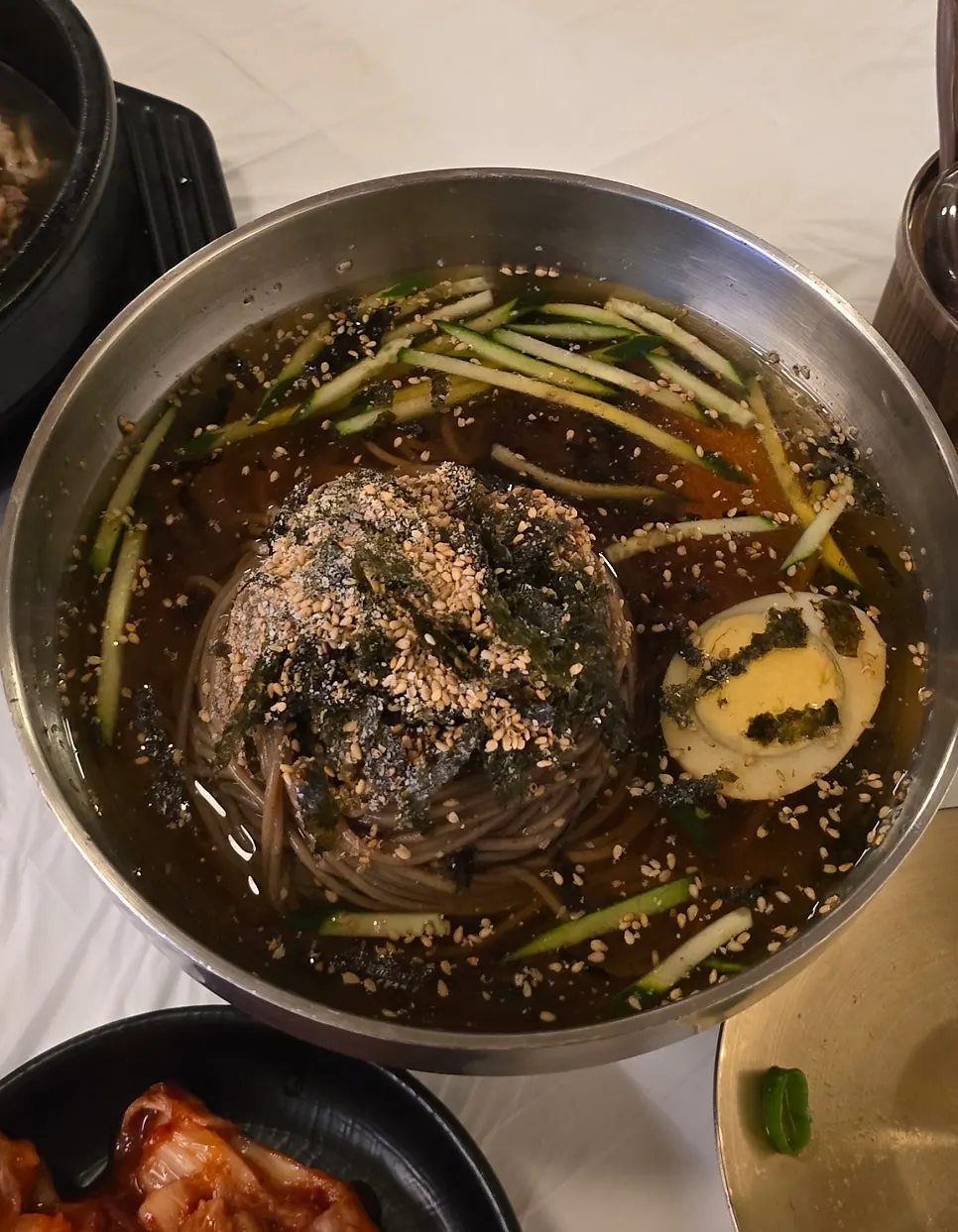 Spicy pork stone pot bibimbap being mixed