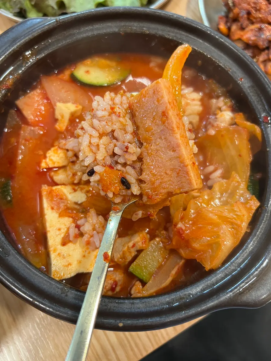 Mixing rice into the stew