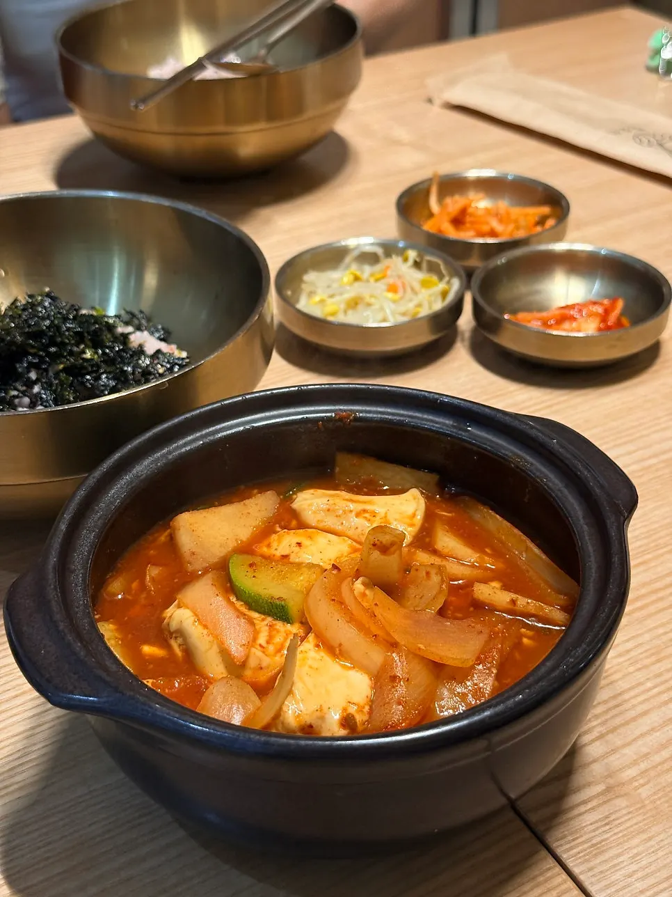 Table with sundubu jjigae and steamed egg