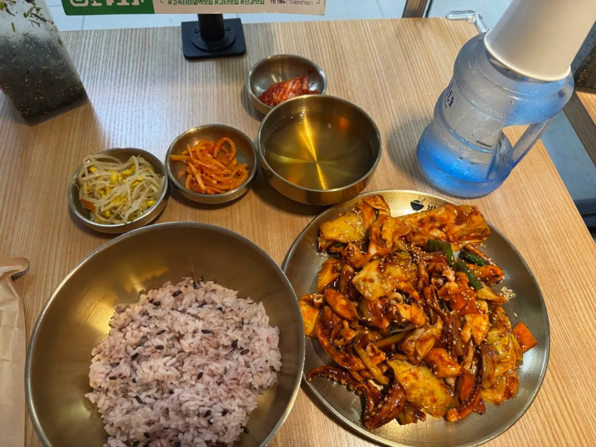 Spicy squid stir-fry and steamed egg table setting