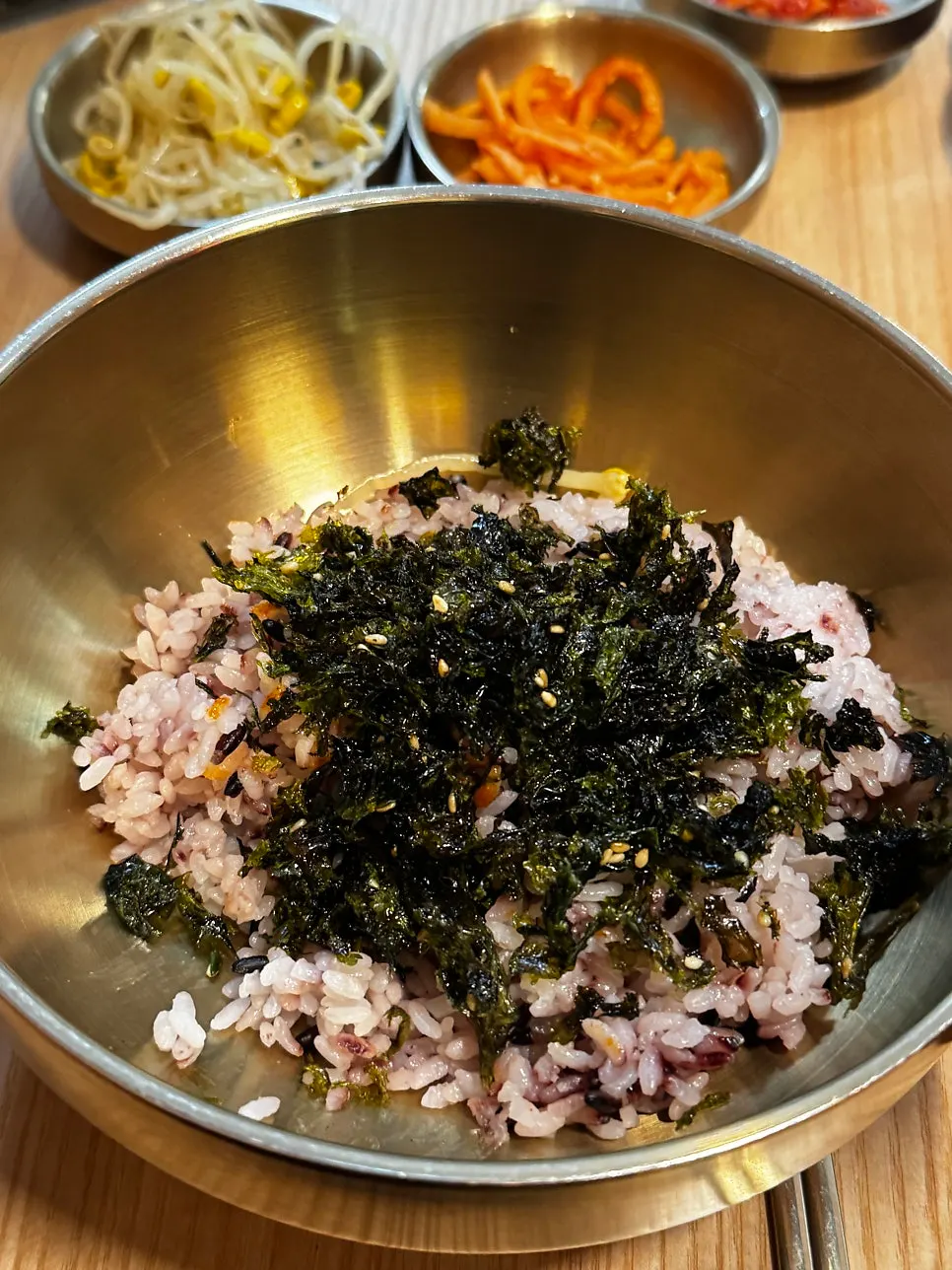 Container of seaweed flakes on the table