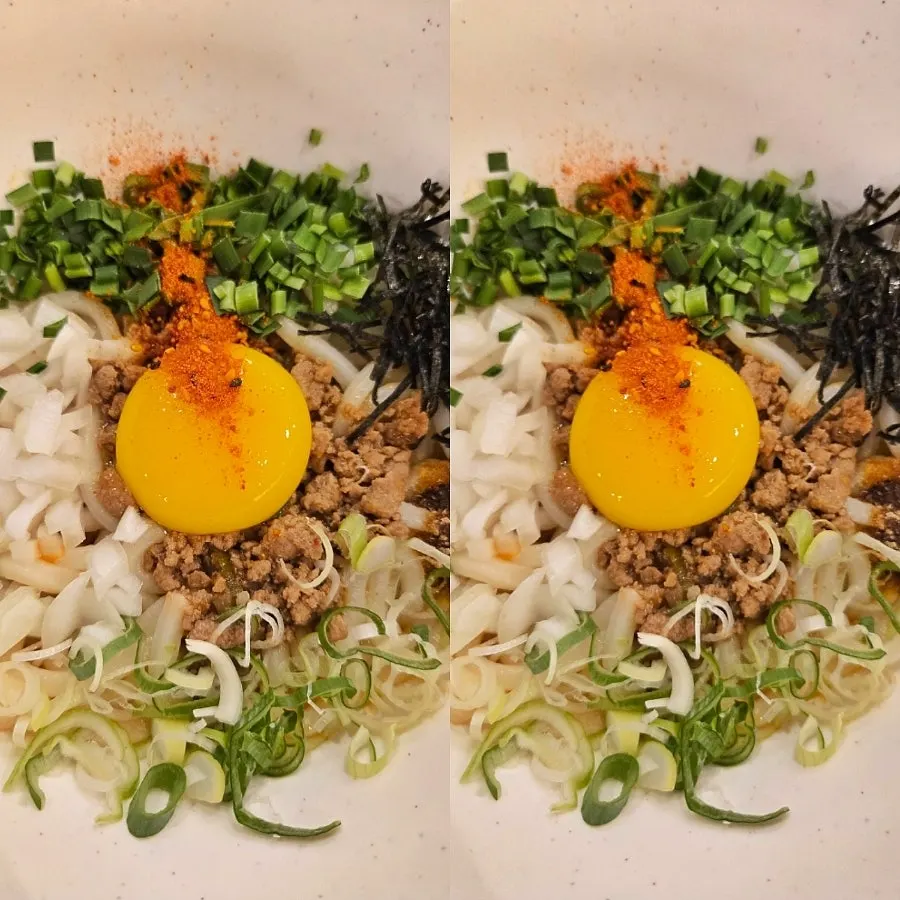Mazesoba udon topped with egg yolk