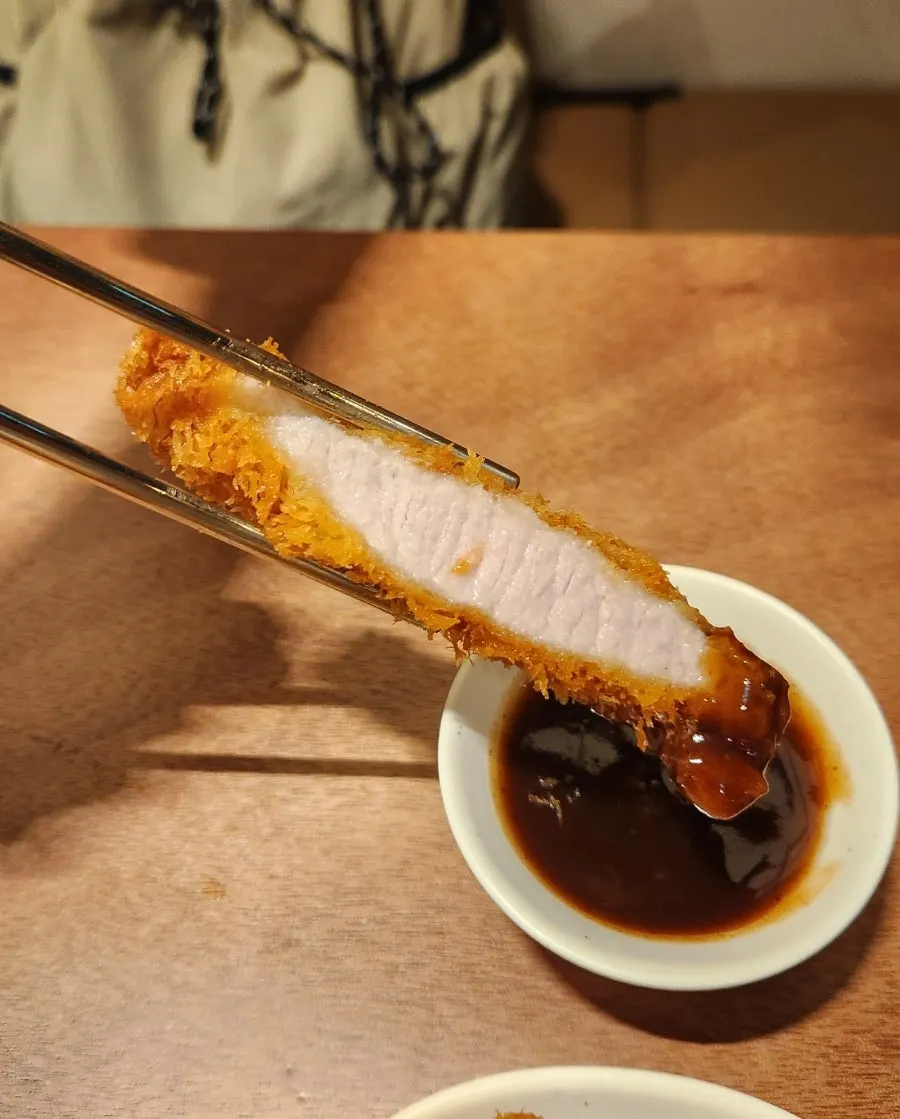 Close-up of the katsu with a juicy cross-section