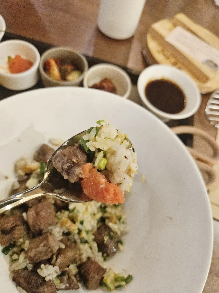 A bowl of sotbap rice scooped out