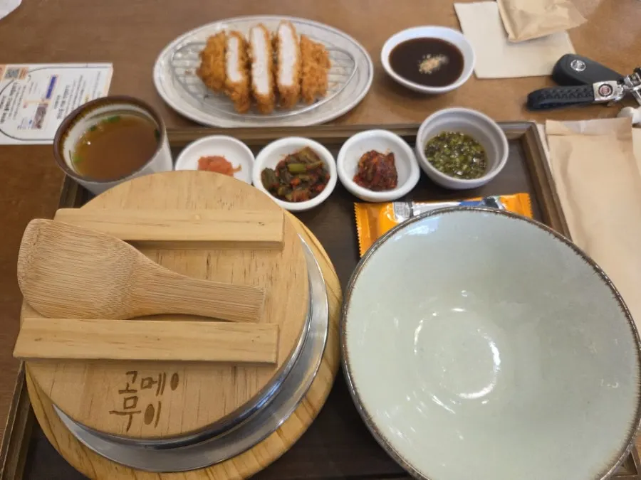 Abalone pot rice and mazesoba udon tonkatsu set spread on the table