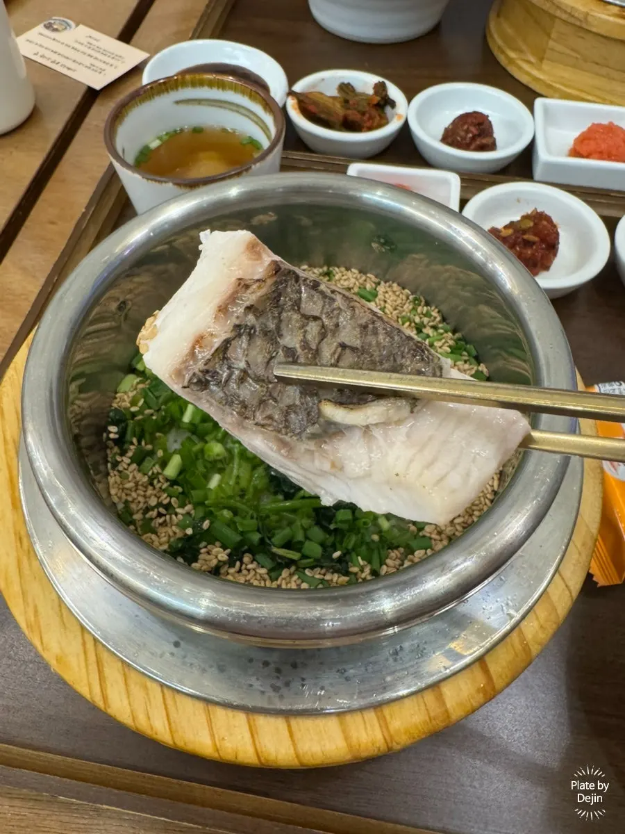Close-up of spring herb and wild sea bream pot rice
