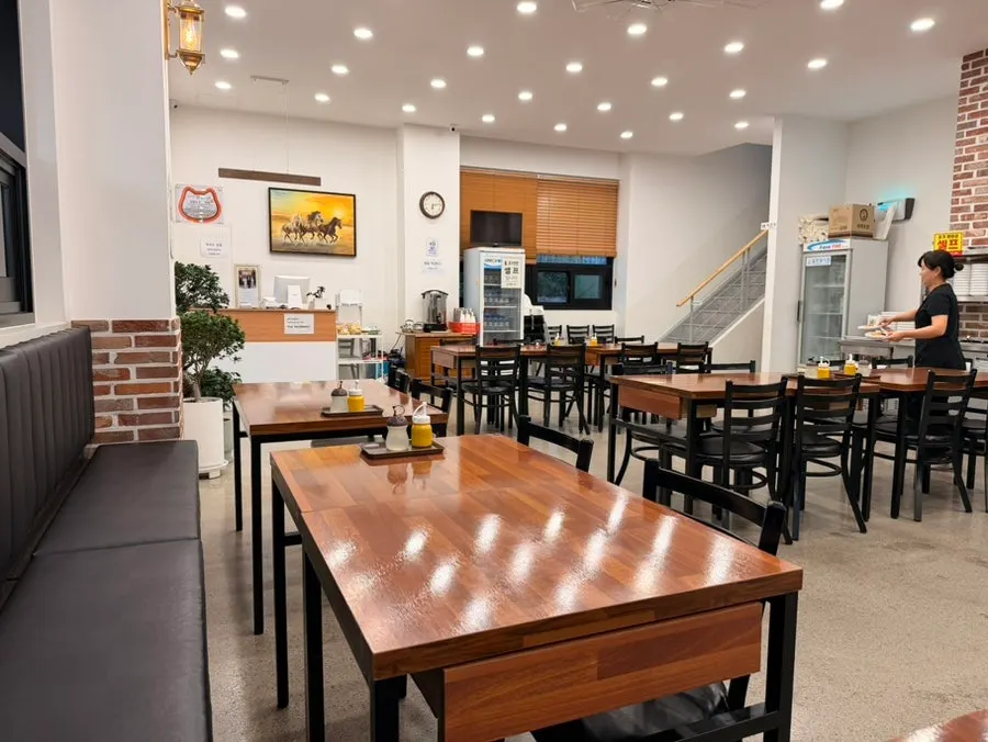 Dining hall with generous spacing between tables