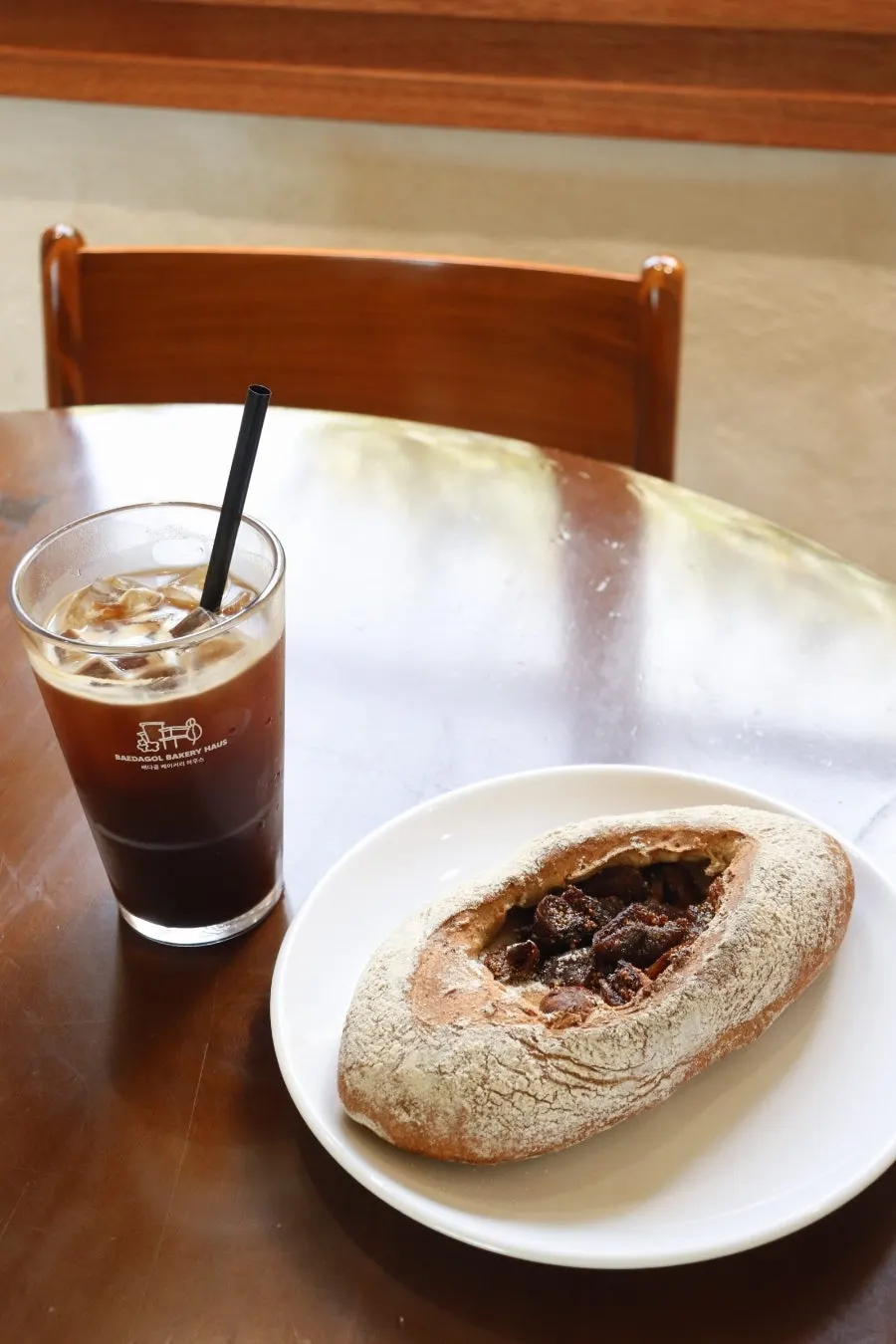 Coffee and bread on a window-side table