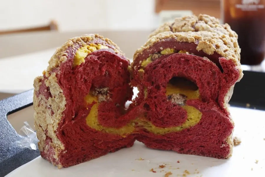 Sliced cross-sections of fig campagne and pumpkin bread