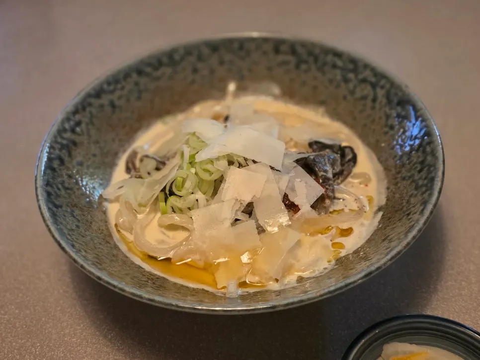 Table spread with perilla cream udon and katsu