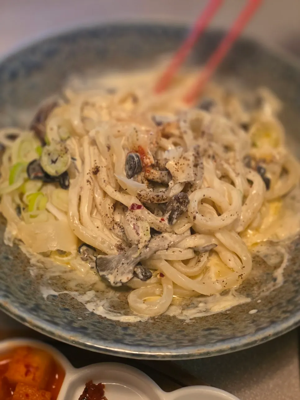 Udon noodles coated in thick cream sauce