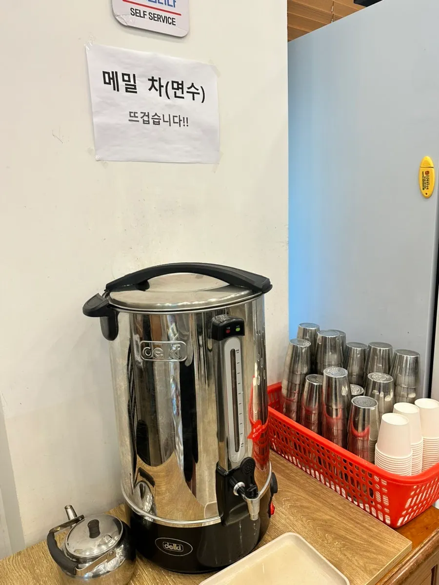 Menu board listing mul-makguksu and perilla buckwheat kalguksu