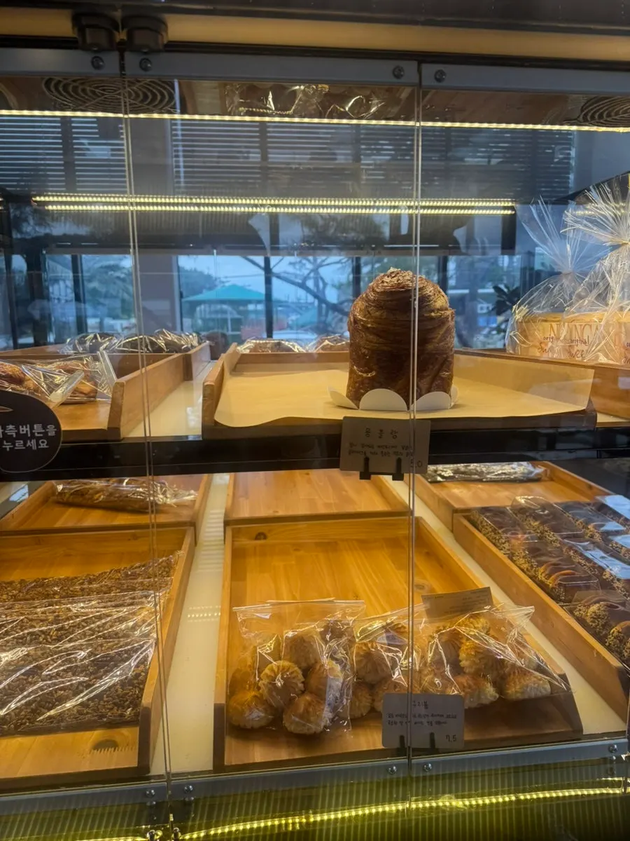 Squid ink roll cheese bread on display at Pine Terrace