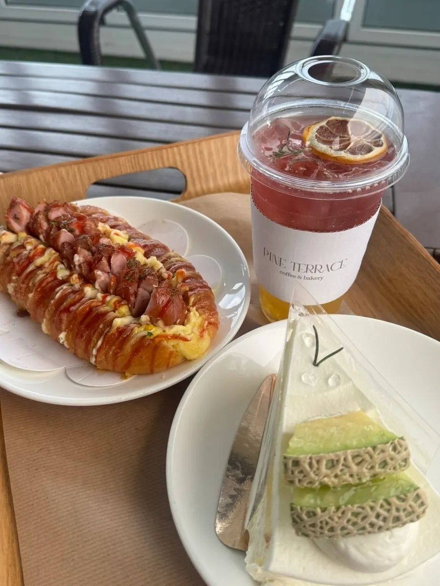 A slice of fresh cream fruit cake with melon