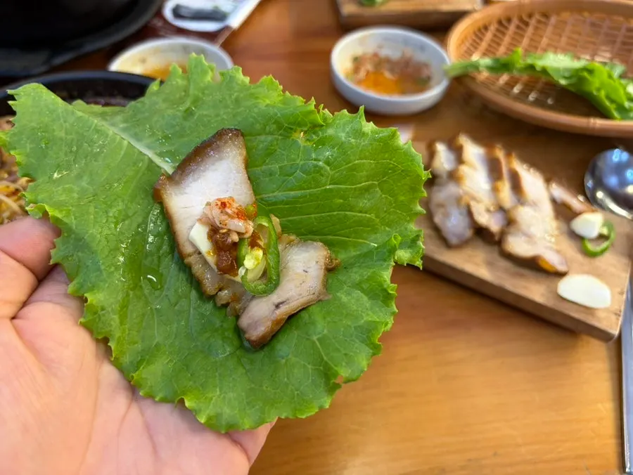 A table setting with haejangguk and makgeolli