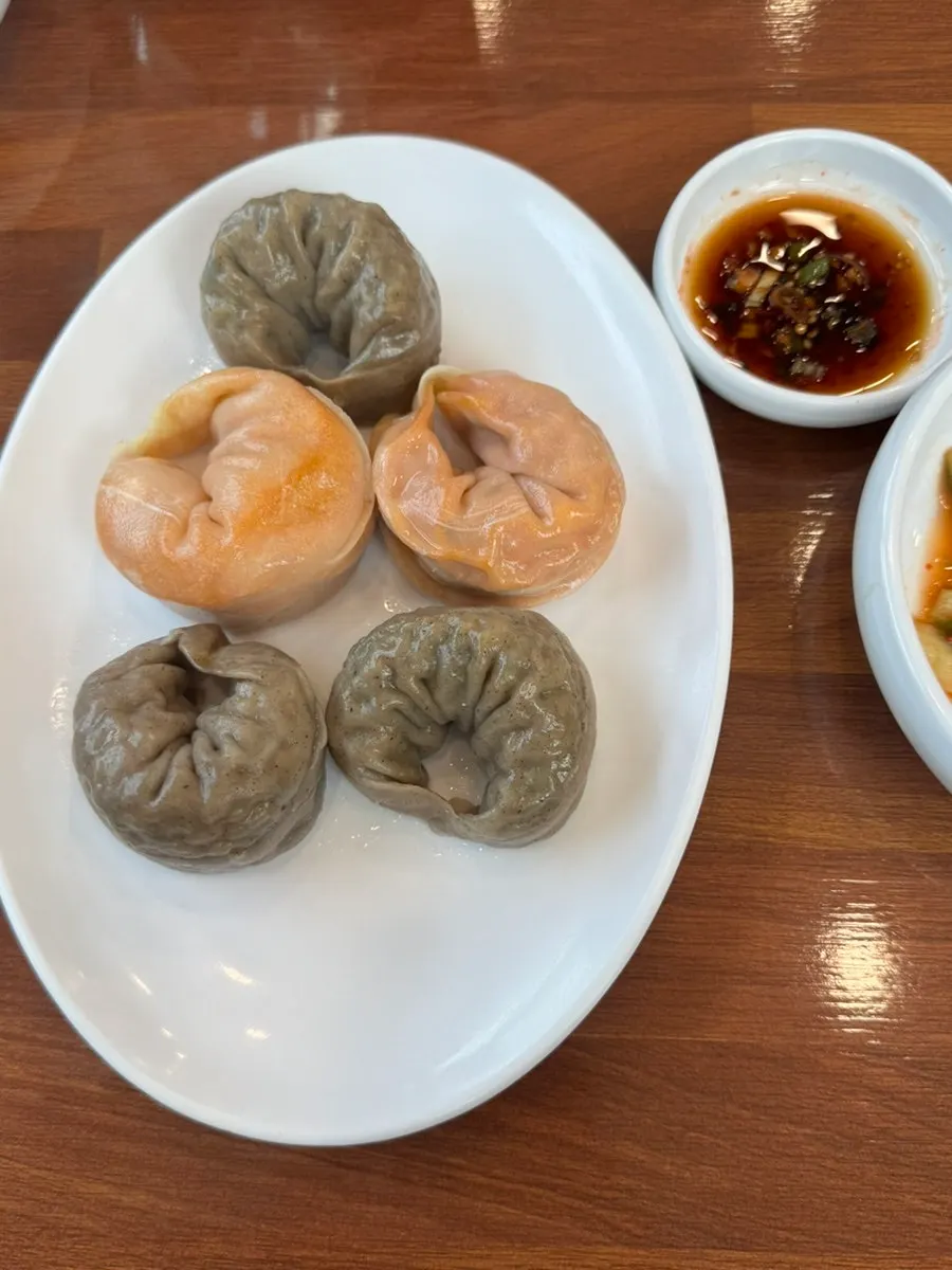 A plate of buckwheat dumplings, half meat and half kimchi