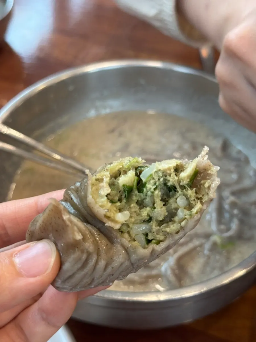 A bitten-into kimchi dumpling