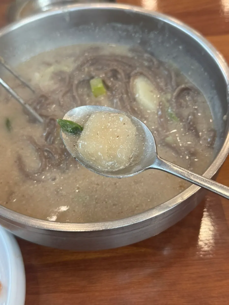 Ongsimi and potato pieces inside the perilla kalguksu