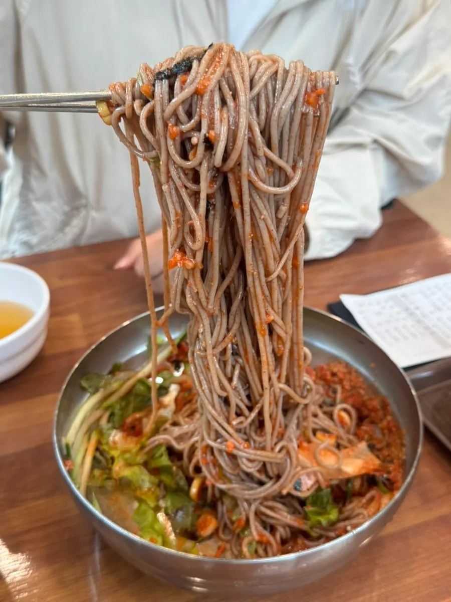 Buckwheat noodles lifted up with chopsticks