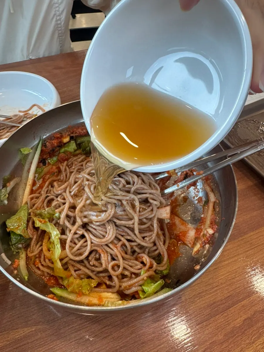Bibim makguksu with the cold broth poured over