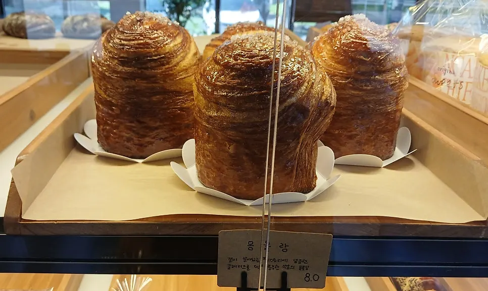 Giant mambos bread and potato & sausage bread on display