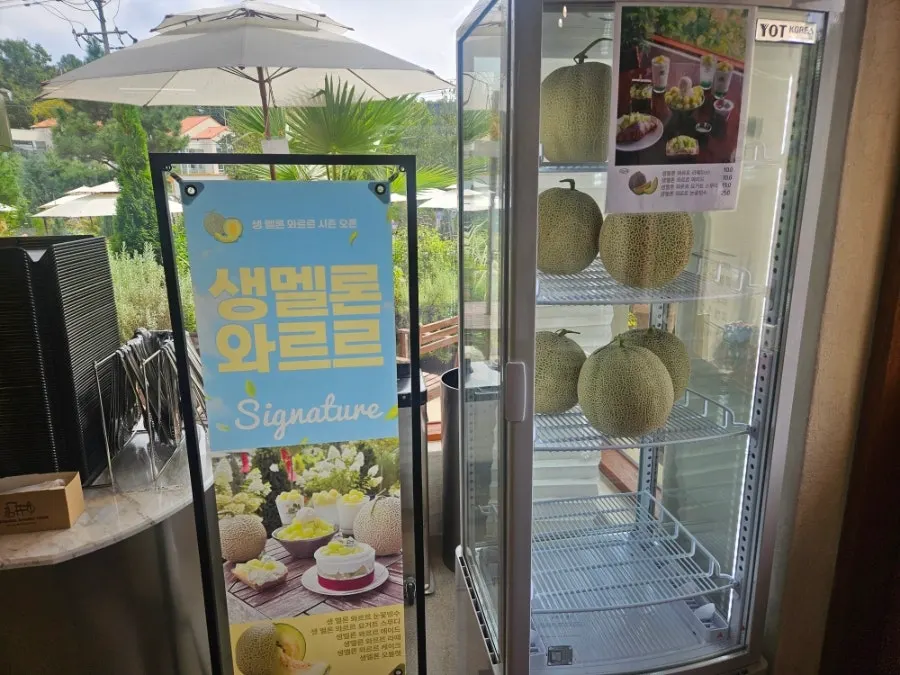 Ordering area with the drink menu board visible