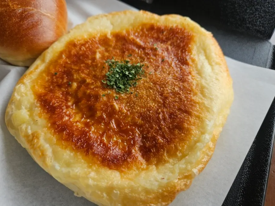 Tomato ham cheese bread on a plate