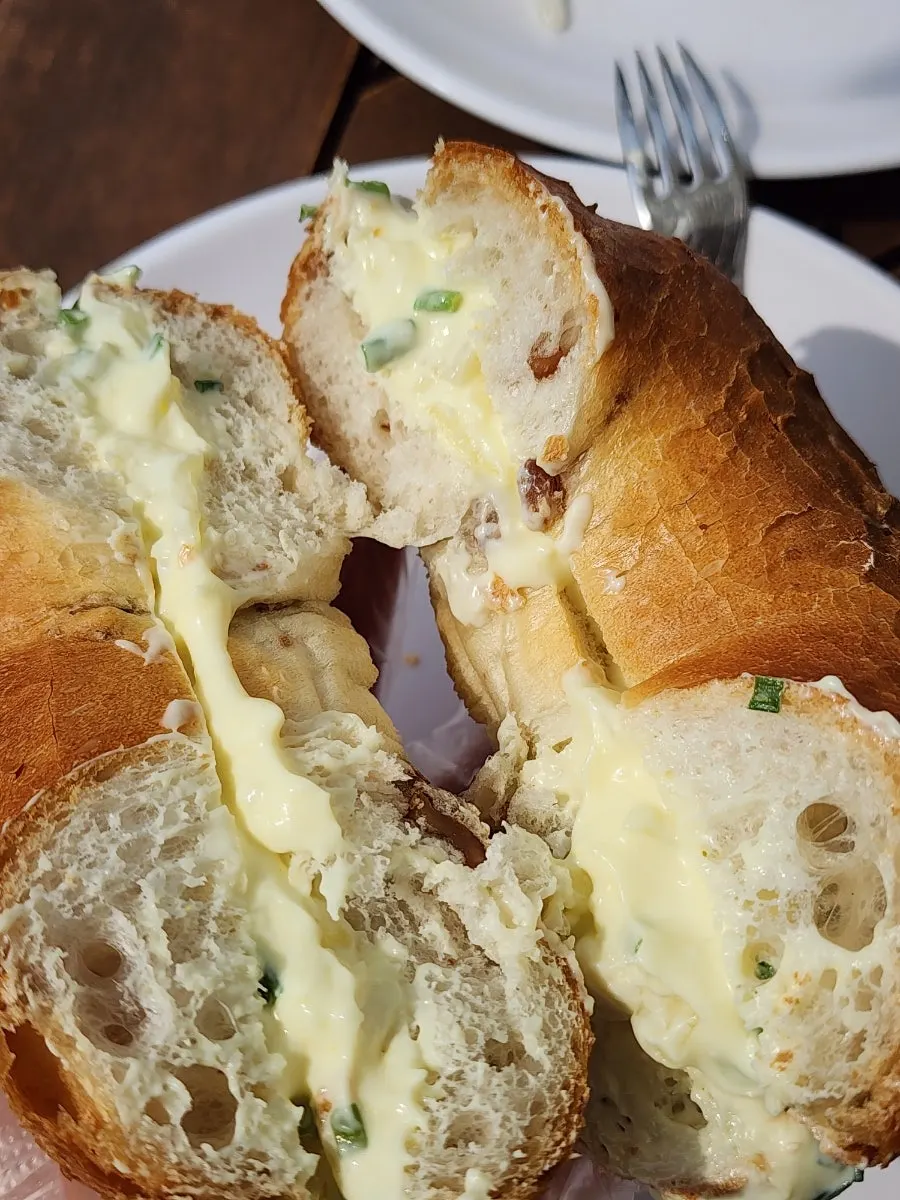 Bread plated with the garden in the background