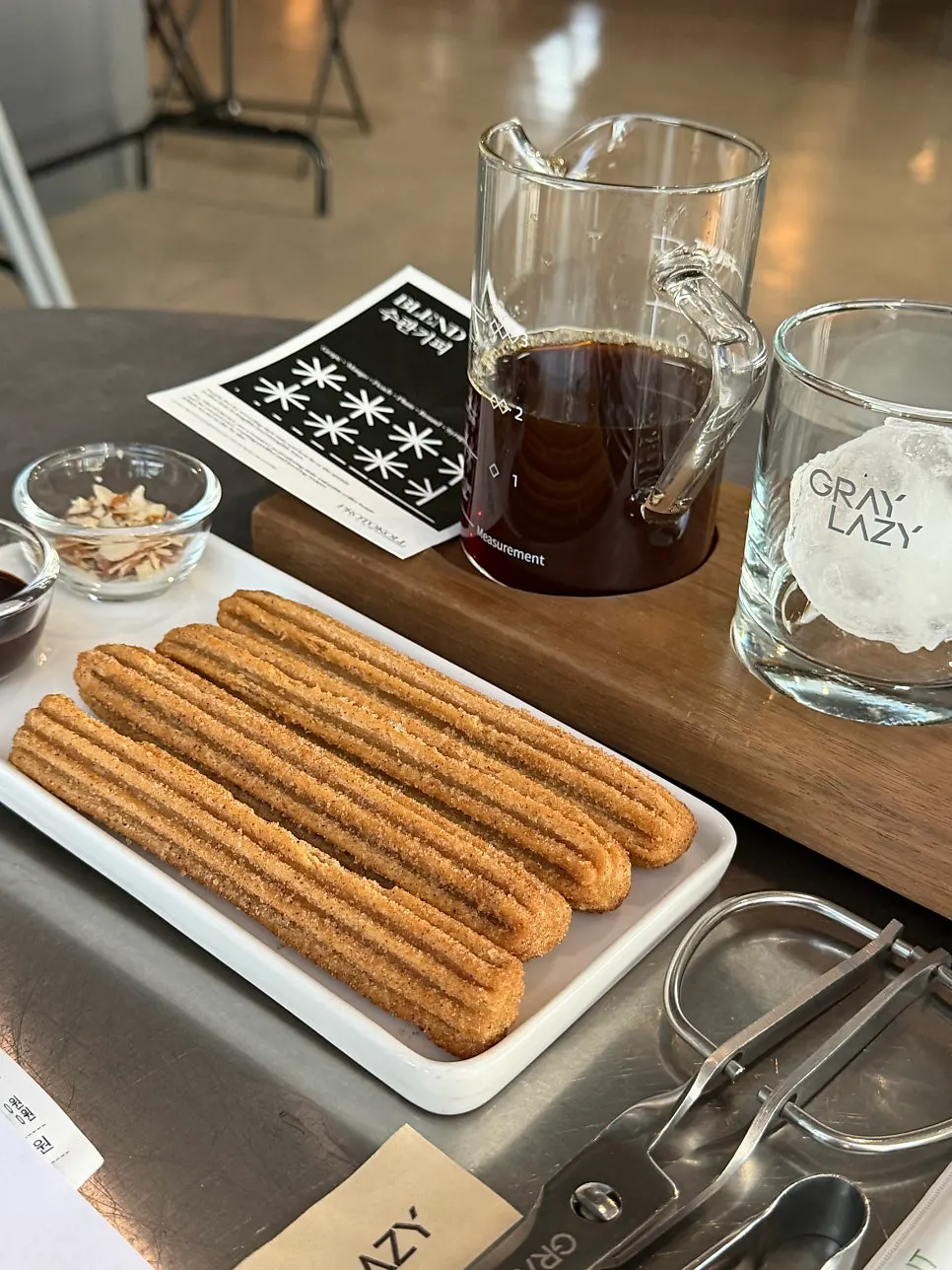 Churros with chocolate dipping and almonds