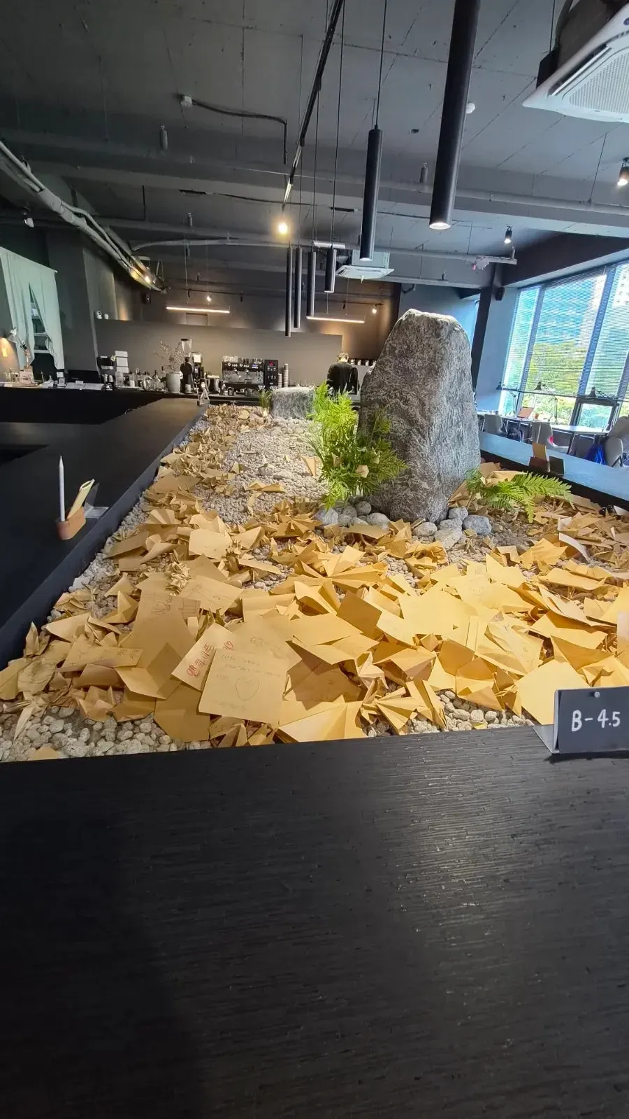 Large indoor dry garden at the center of GRAY LAZY