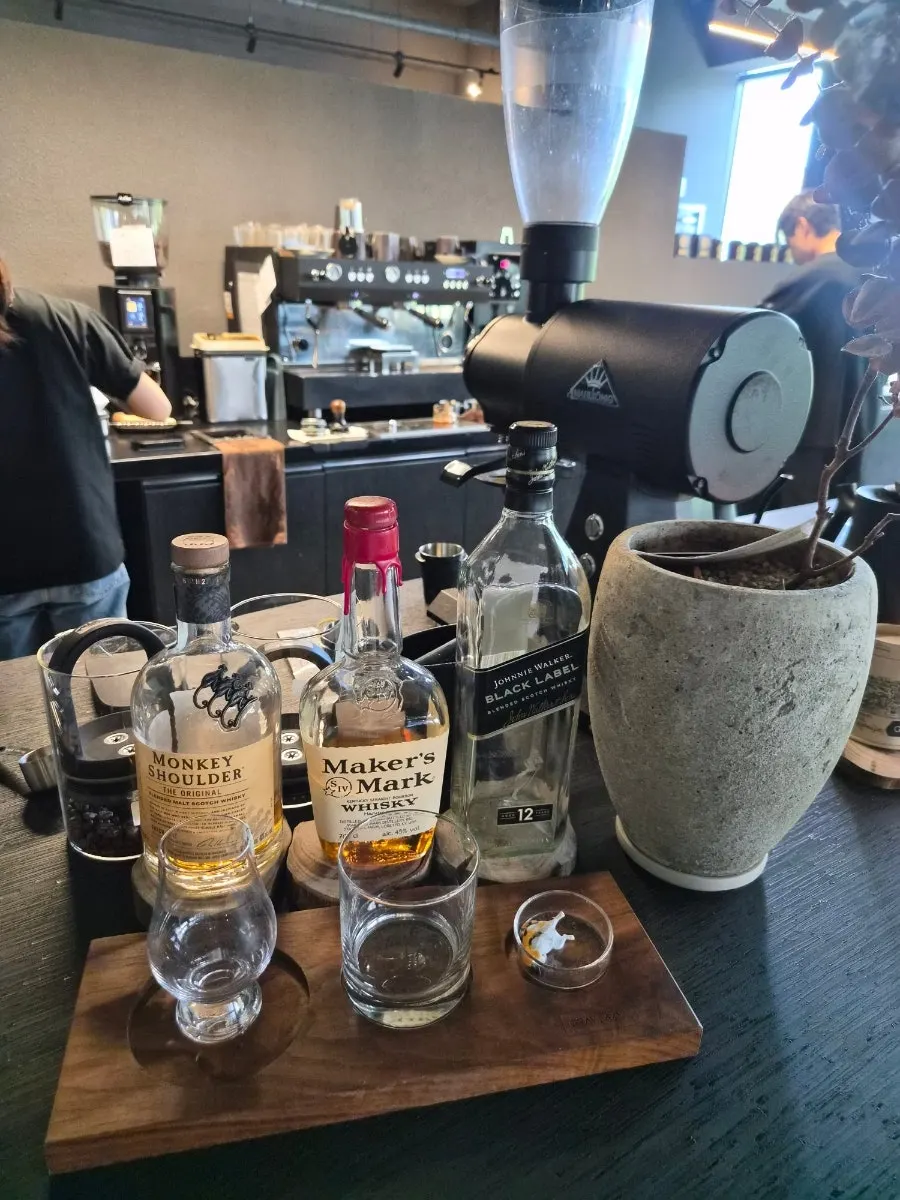 Three whiskies displayed at the bar