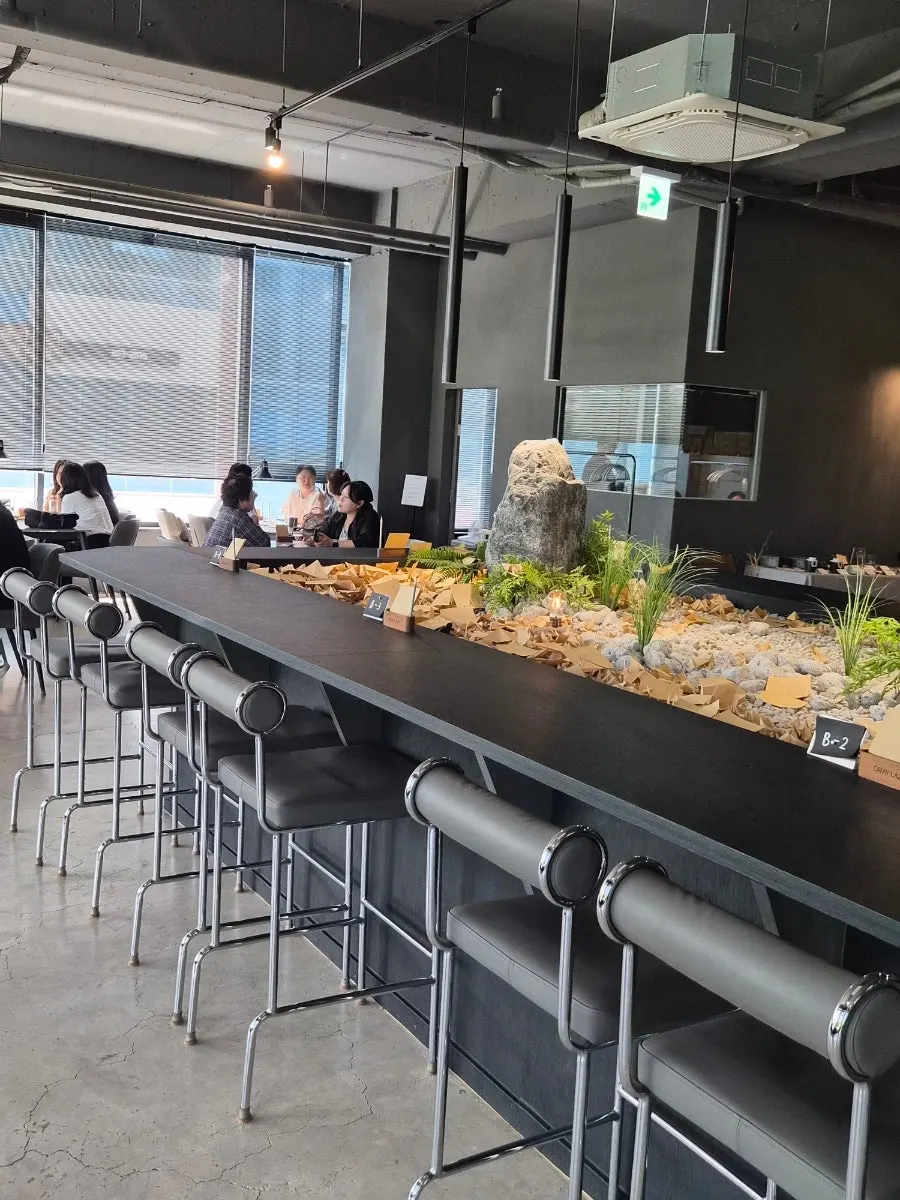 Café interior with a view of the park outside