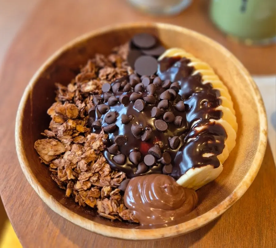 Choco banana Greek yogurt topped with banana and chocolate