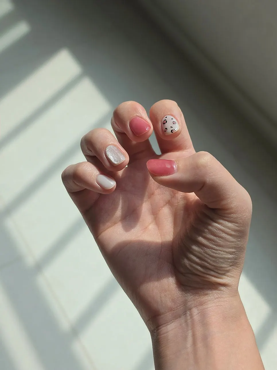 Autumn gel nails seen in outdoor natural light